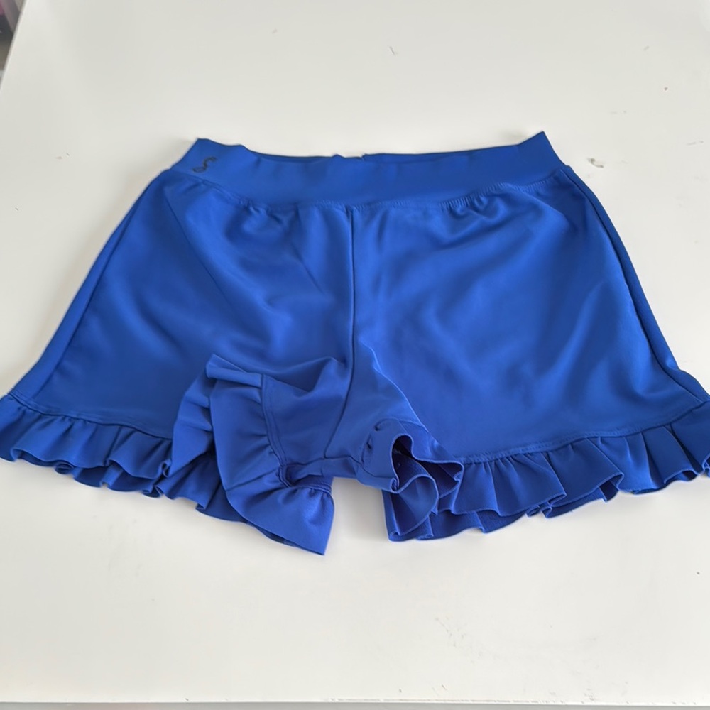 Soel Dancewear Blue Ruffle Hem Shorts. Logo on front. 3” inseam. Size- child XL